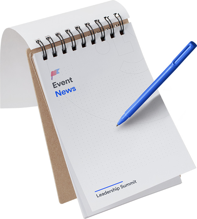 Spiral-bound notepad with text 'Event News' and 'Leadership Summit', accompanied by a blue pen.