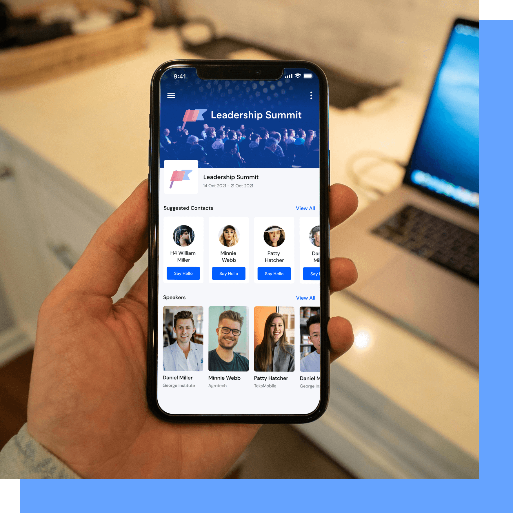Hand holding a smartphone displaying a Leadership Summit app with suggested contacts and speakers.