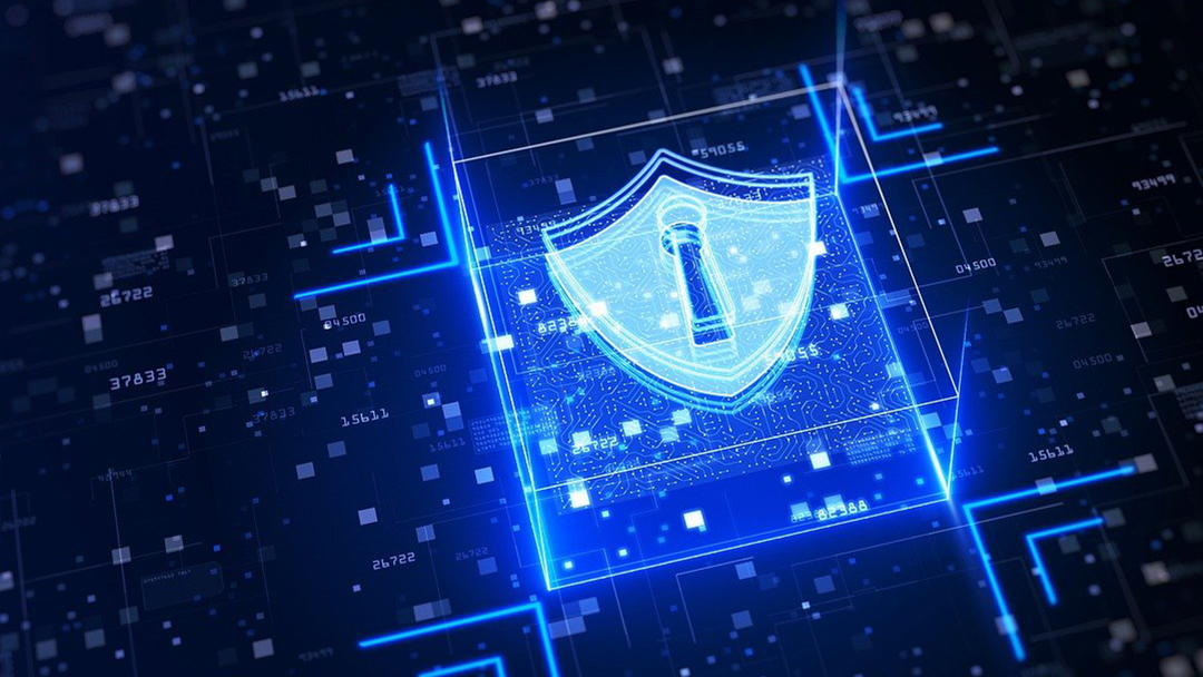Glowing blue digital shield with a keyhole icon surrounded by data and circuit patterns representing cybersecurity.